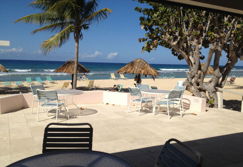 The patio and beach outside of the great room at Gentle Winds on St. Croix.
